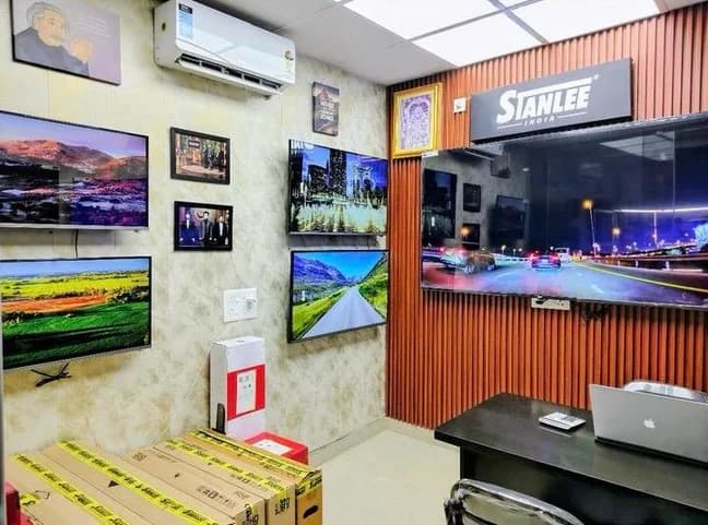 Inside the Mohan Nagar flagship — panels wall-mounted side by side, stock on the floor